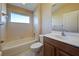 Clean bathroom with tub, toilet and vanity at 2134 Boxwood St, North Port, FL 34289