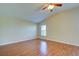 Bright bedroom with wood flooring and ceiling fan at 2134 Boxwood St, North Port, FL 34289