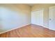 Simple bedroom with wood floors and closet at 2134 Boxwood St, North Port, FL 34289