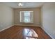 Bright bedroom with wood floors and large window at 2134 Boxwood St, North Port, FL 34289