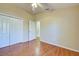 Bedroom with wood floors, closet and access to bathroom at 2134 Boxwood St, North Port, FL 34289