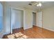 Bedroom with wood floors and a walk-in closet at 2134 Boxwood St, North Port, FL 34289