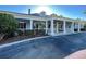 Community center with columns and rocking chairs on porch at 2134 Boxwood St, North Port, FL 34289
