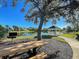 Relaxing gazebo by the lake with picnic tables and grill at 2134 Boxwood St, North Port, FL 34289