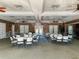 Spacious community room with tables and chairs at 2134 Boxwood St, North Port, FL 34289