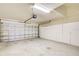 Spacious garage with ample storage cabinets and overhead storage at 2134 Boxwood St, North Port, FL 34289