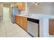 Kitchen boasts stainless steel appliances and wood cabinets at 2134 Boxwood St, North Port, FL 34289