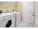 Convenient laundry room with washer and dryer at 2134 Boxwood St, North Port, FL 34289