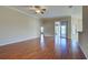 Spacious living room with wood flooring and access to the lanai at 2134 Boxwood St, North Port, FL 34289