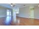 Spacious living room with wood flooring and access to the lanai at 2134 Boxwood St, North Port, FL 34289