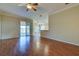 Spacious living room with wood flooring and access to the lanai at 2134 Boxwood St, North Port, FL 34289