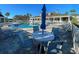 Community pool with lounge chairs and tables at 2134 Boxwood St, North Port, FL 34289
