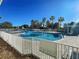 Community pool with surrounding lounge chairs at 2134 Boxwood St, North Port, FL 34289
