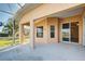 Covered patio with a view of the backyard and lake at 2134 Boxwood St, North Port, FL 34289