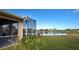 Screened lanai overlooking a peaceful lake at 2134 Boxwood St, North Port, FL 34289