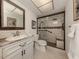 Elegant bathroom with granite vanity and walk-in shower at 214 Field E Ave # 1, Venice, FL 34285