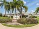Community entrance with landscaping and signage at 214 Field E Ave # 1, Venice, FL 34285