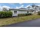 Single-story home with landscaped yard and driveway at 214 Field E Ave # 1, Venice, FL 34285