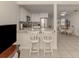 Kitchen with granite countertops, white cabinets, and stainless steel appliances at 214 Field E Ave # 1, Venice, FL 34285
