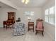 Home office space with antique furniture and a rocking chair at 214 Field E Ave # 1, Venice, FL 34285