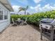 Backyard patio with grill and dining set at 214 Field E Ave # 1, Venice, FL 34285