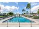 Community pool with ample lounge chairs at 214 Field E Ave # 1, Venice, FL 34285