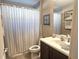 Clean bathroom with shower/tub combo, vanity, and tile floor at 2179 Chenille Ct, Venice, FL 34292