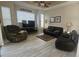 Living room with hardwood floors, a couch, and a recliner at 2179 Chenille Ct, Venice, FL 34292