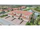 Aerial view of townhouses near a lake at 23253 Banbury Way, Venice, FL 34293