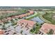Aerial view of community with lake and villas at 23253 Banbury Way, Venice, FL 34293