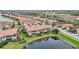 Aerial view of a beautiful home nestled in a tranquil waterfront community at 23253 Banbury Way, Venice, FL 34293