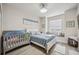 Main bedroom with window seat and crib at 23253 Banbury Way, Venice, FL 34293