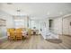 Bright dining room with wood table and chairs, hardwood floors, and a chandelier at 23253 Banbury Way, Venice, FL 34293