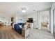 Living room with blue couch and wood floor at 23253 Banbury Way, Venice, FL 34293