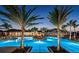 Stunning nighttime view of the community pool and spa at 23253 Banbury Way, Venice, FL 34293