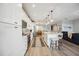 Well-lit kitchen with stainless steel appliances, a center island with seating, and an open-concept layout at 23253 Banbury Way, Venice, FL 34293