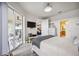 Comfortable main bedroom featuring a TV, outdoor access, and an ensuite bathroom at 23253 Banbury Way, Venice, FL 34293