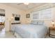 Bedroom with a queen bed and view of dining area at 244 Saint Augustine Ave # 107, Venice, FL 34285