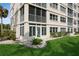 Building exterior showcasing landscaping and lawn at 244 Saint Augustine Ave # 107, Venice, FL 34285