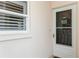 Inviting condo entrance with a screen door and window at 244 Saint Augustine Ave # 107, Venice, FL 34285