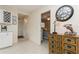 Kitchen entryway with wine rack and view into bedroom at 244 Saint Augustine Ave # 107, Venice, FL 34285
