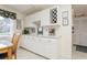 White kitchen cabinets with granite countertop and wine rack at 244 Saint Augustine Ave # 107, Venice, FL 34285