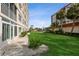 Well-maintained lawn with building exterior view at 244 Saint Augustine Ave # 107, Venice, FL 34285