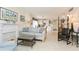 Open living room with adjacent kitchen and dining area at 244 Saint Augustine Ave # 107, Venice, FL 34285