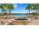 Relaxing pool area with fire pit and lounge chairs at 257 Calmar Way, Nokomis, FL 34275