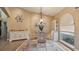 Charming dining room with white table and chairs, hardwood floor at 2714 Lake View Blvd, Port Charlotte, FL 33948