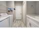 Laundry room with washer, dryer, and extra storage space at 309 Pavonia Rd, Nokomis, FL 34275