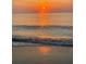 Sunrise over the ocean with gentle waves at 3110 Siesta Dr, Venice, FL 34293