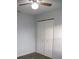 Simple bedroom with wood-look floors and double door closet at 3110 Siesta Dr, Venice, FL 34293