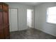 Spacious bedroom with wood-look floors and an adjacent bathroom at 3110 Siesta Dr, Venice, FL 34293